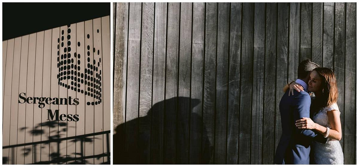 Romantic wedding photo of the bride and groom embracing in front of Sergeants Mess Mosman.